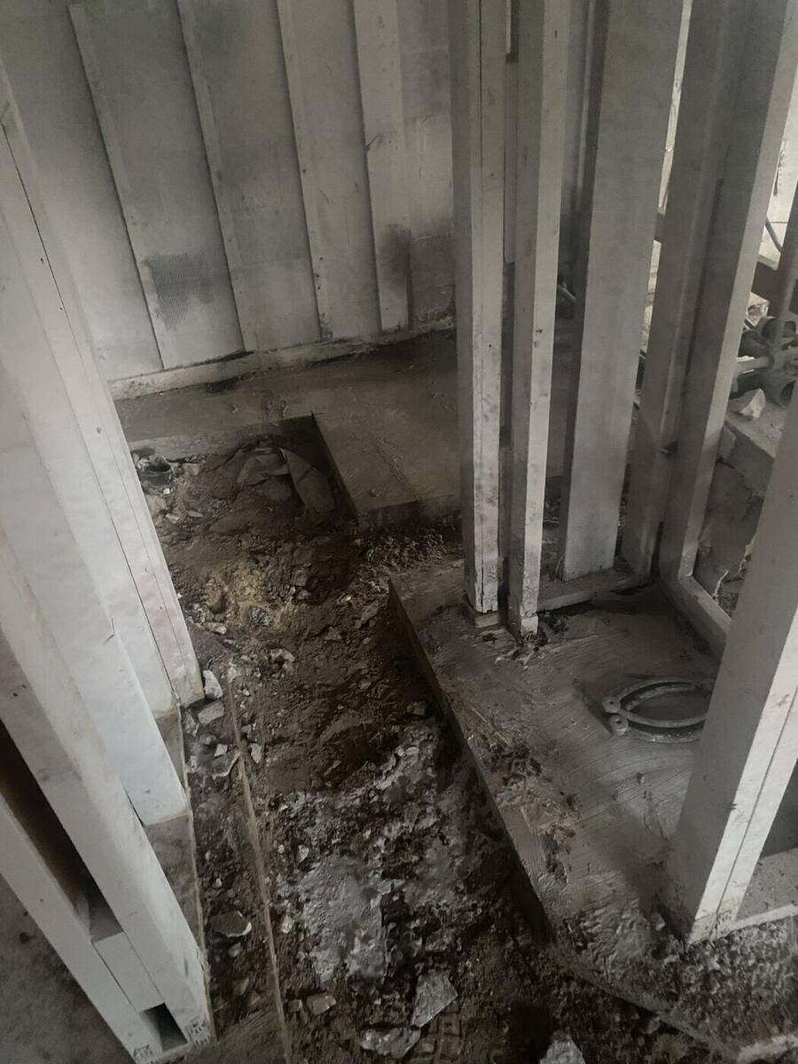 Concrete removed for plumbing trench during an Orange Park remodel