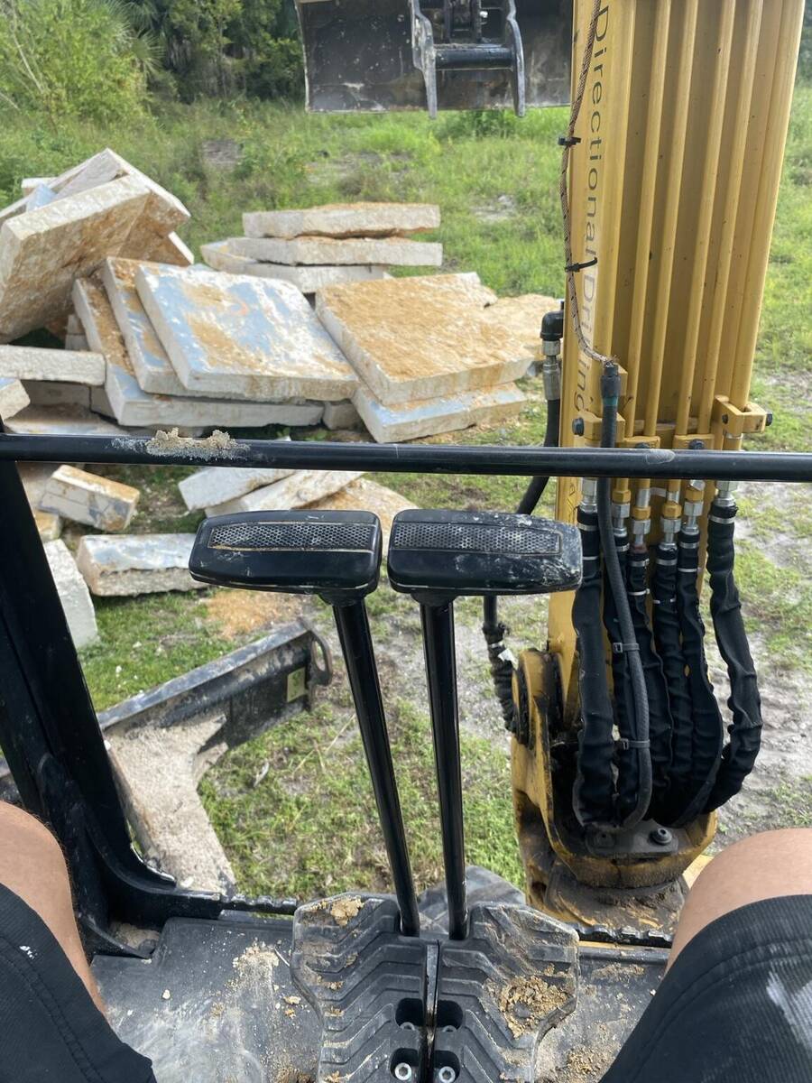 Concrete removal equipment loading concrete in Palatka Florida