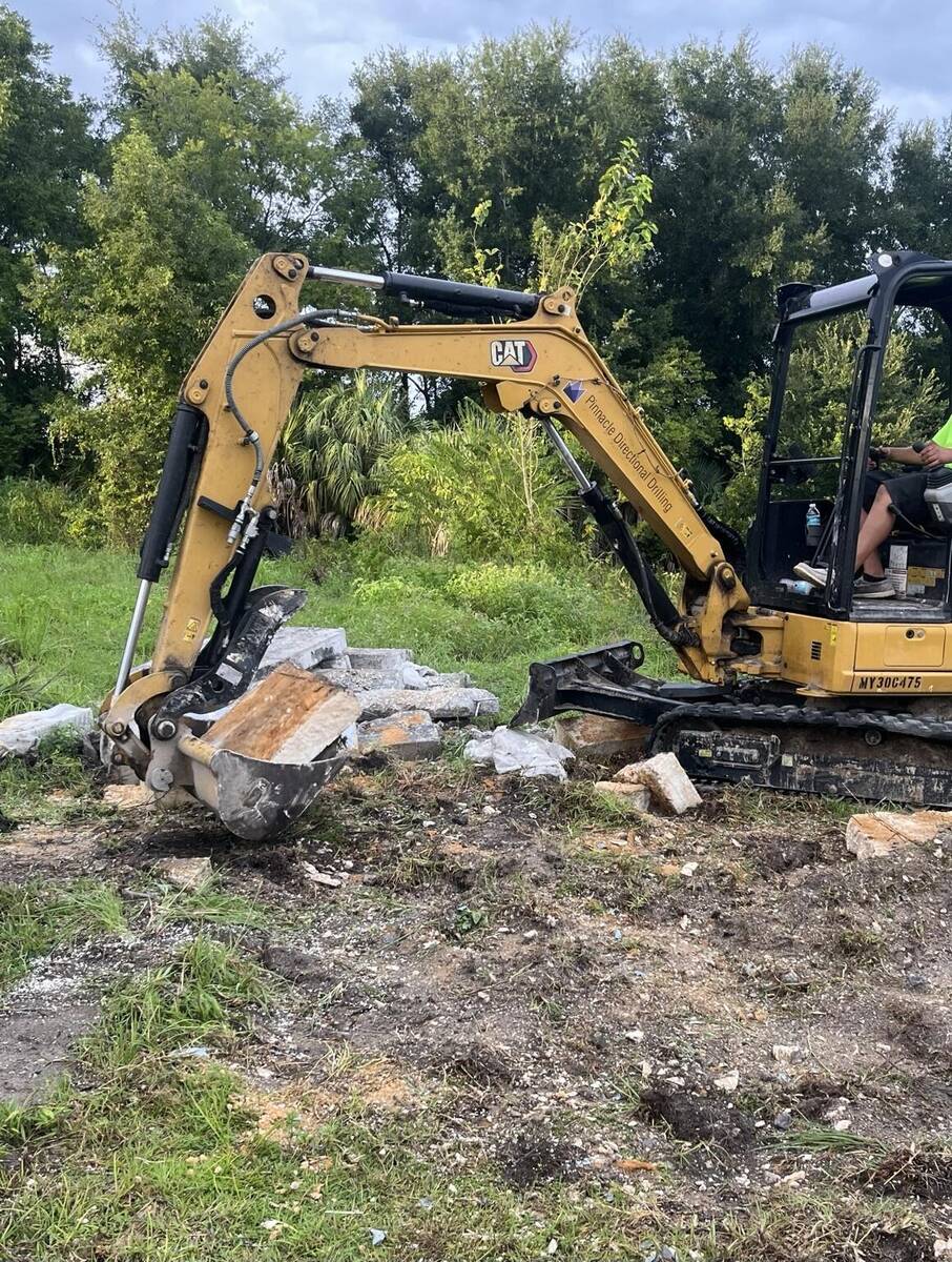 Excavator handling concrete removal in Palatka Florida