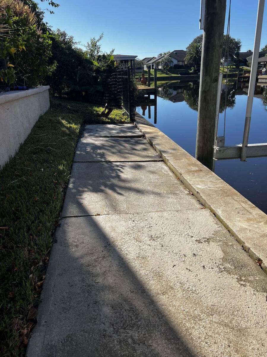 Concrete walkway before removal in Palm Coast Florida