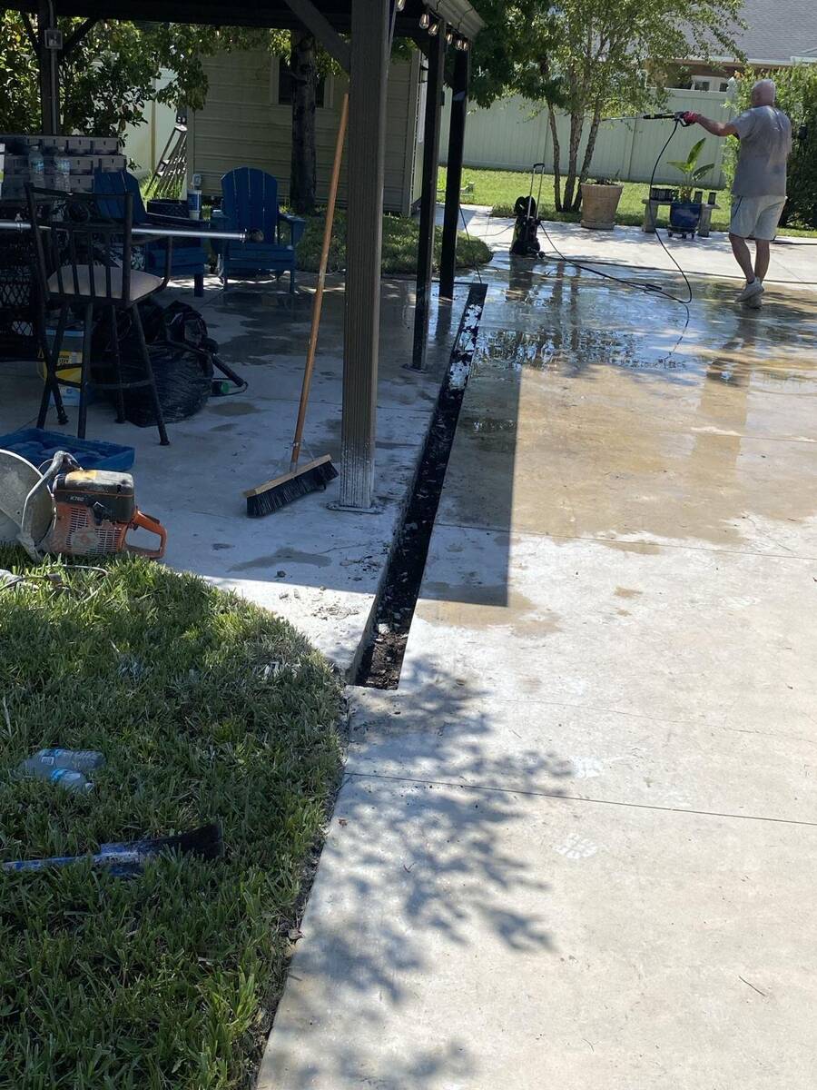 After concrete trench cutting for trough drain installation in St Augustine Florida