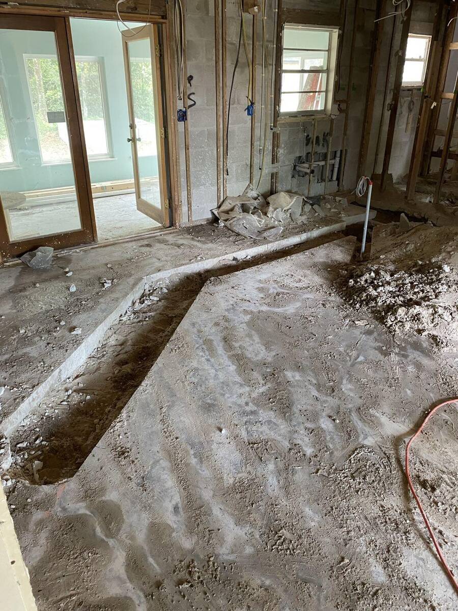 Concrete plumbing trench cut and removed for residential renovation in St Augustine Florida